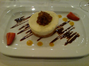 Cheesecake with piped fig coulis on top
