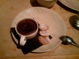 Warm chocolate pot with biscuits